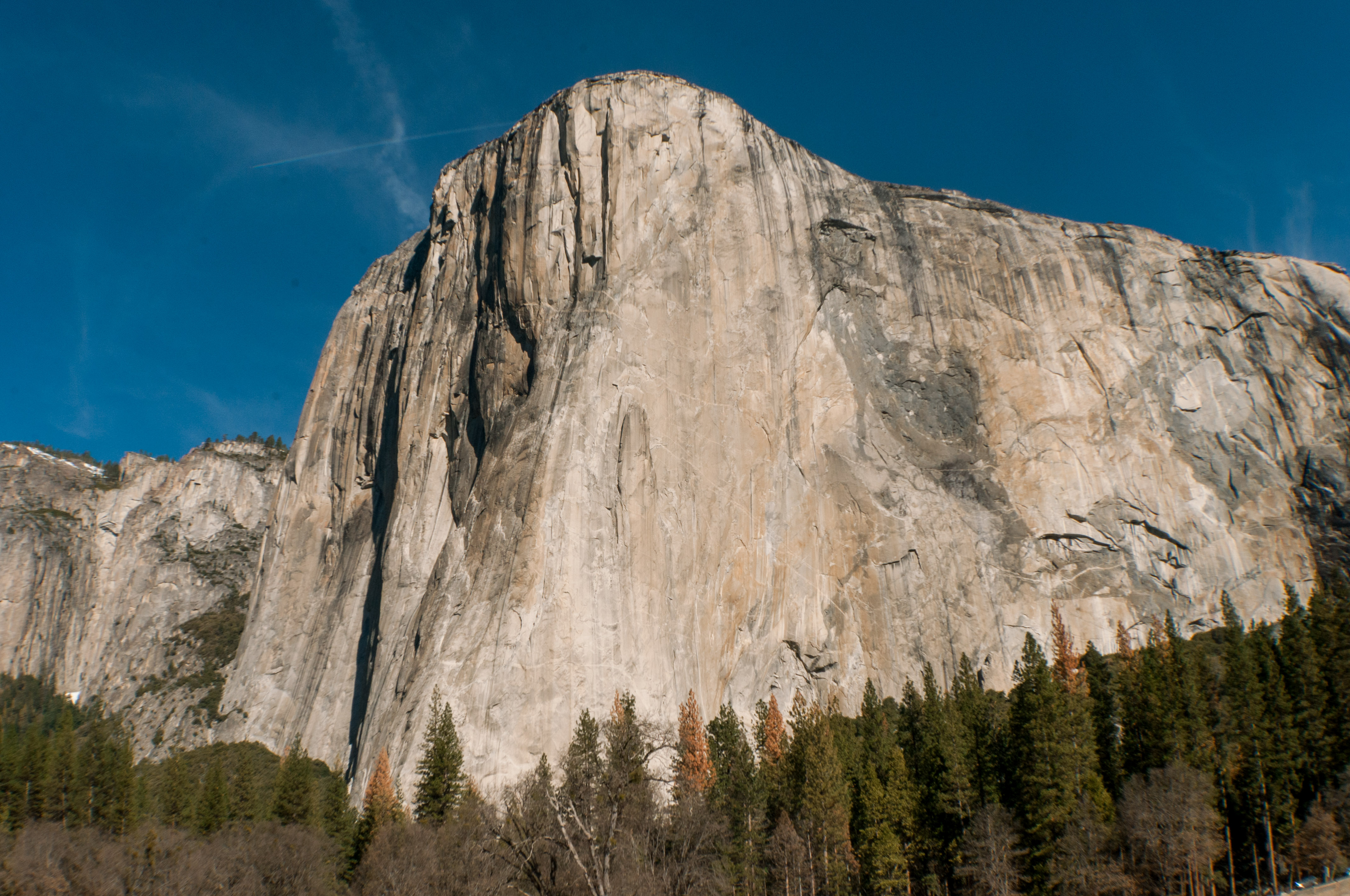 El Capitan in Yosemite National Park in California in the United States.  Large granite structure towering over all of Yosemite. 